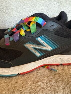 New Balance Kids Black Sneakers with Rainbow Laces and Blue Logo